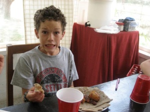 Drew getting ready to eat injera. The Kennedy’s were amazing! They ate it like champs.